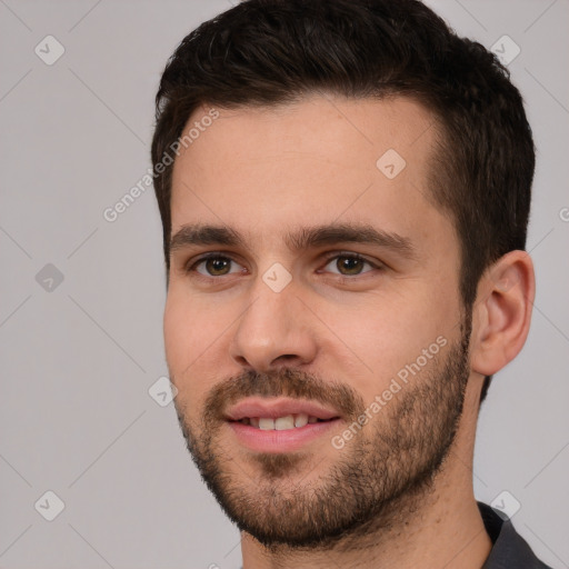 Joyful white young-adult male with short  brown hair and brown eyes