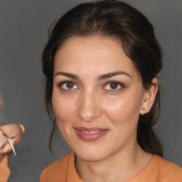 Joyful white adult female with medium  brown hair and brown eyes