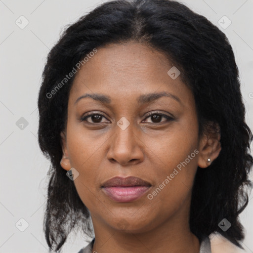 Joyful black adult female with medium  brown hair and brown eyes