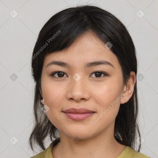 Joyful asian young-adult female with medium  black hair and brown eyes