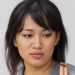 Neutral asian young-adult female with medium  brown hair and brown eyes