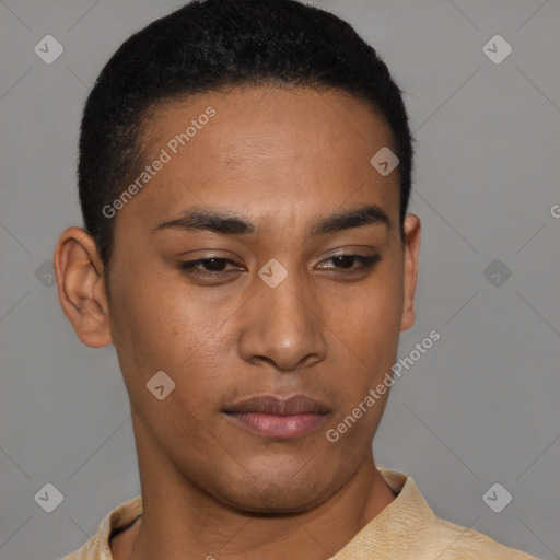 Joyful latino young-adult male with short  brown hair and brown eyes