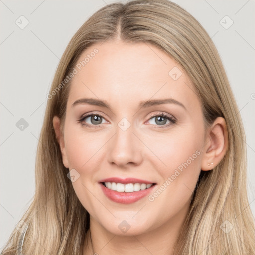 Joyful white young-adult female with long  brown hair and grey eyes