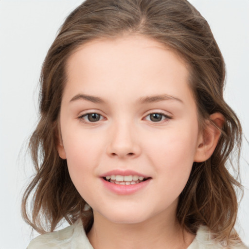 Joyful white child female with medium  brown hair and brown eyes