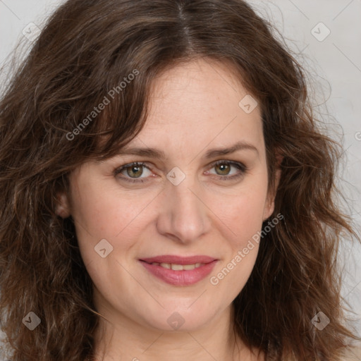 Joyful white adult female with medium  brown hair and green eyes