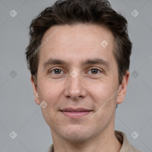 Joyful white adult male with short  brown hair and grey eyes