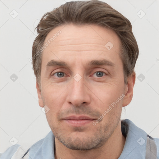 Joyful white adult male with short  brown hair and grey eyes