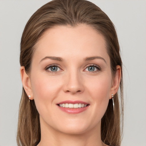 Joyful white young-adult female with long  brown hair and grey eyes