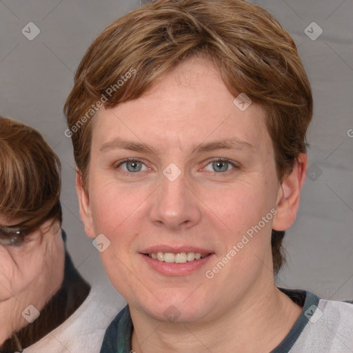 Joyful white adult female with medium  brown hair and blue eyes