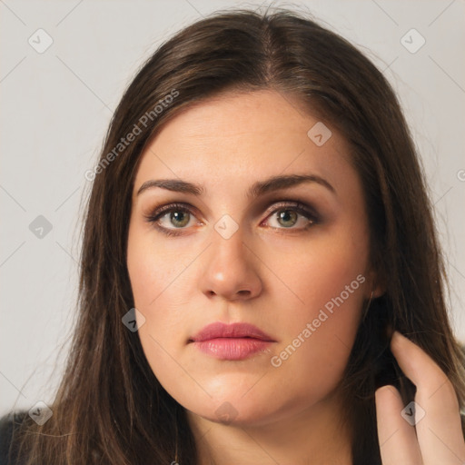 Neutral white young-adult female with long  brown hair and brown eyes