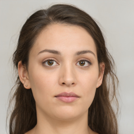 Neutral white young-adult female with long  brown hair and brown eyes