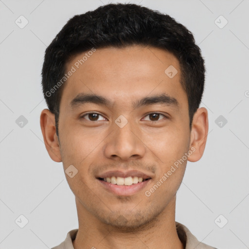 Joyful asian young-adult male with short  black hair and brown eyes