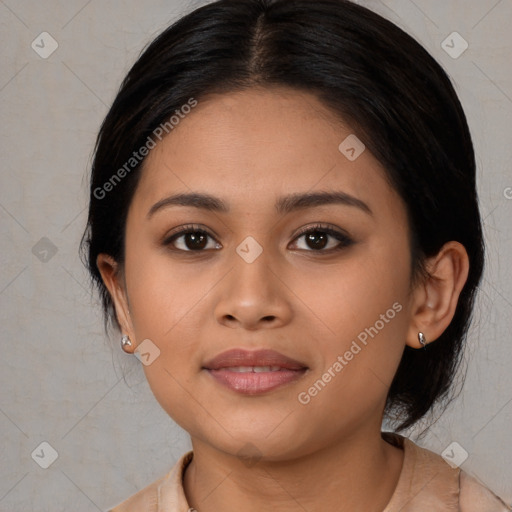 Joyful latino young-adult female with medium  brown hair and brown eyes