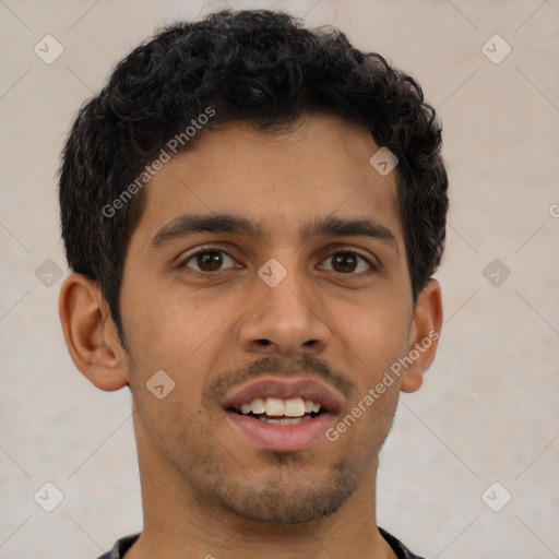 Joyful latino young-adult male with short  brown hair and brown eyes