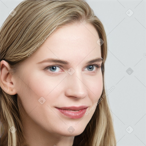 Joyful white young-adult female with long  brown hair and blue eyes