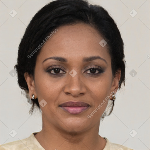 Joyful black adult female with short  brown hair and brown eyes