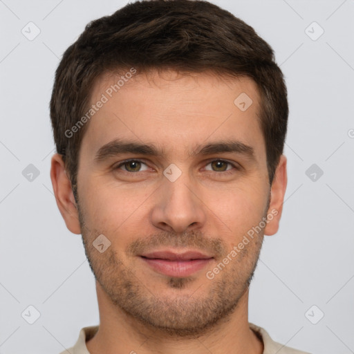 Joyful white young-adult male with short  brown hair and brown eyes