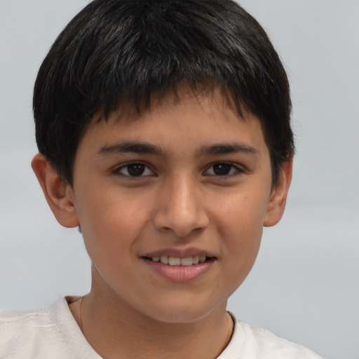 Joyful white child male with short  brown hair and brown eyes