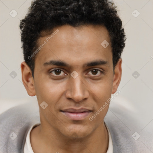 Joyful black young-adult male with short  brown hair and brown eyes