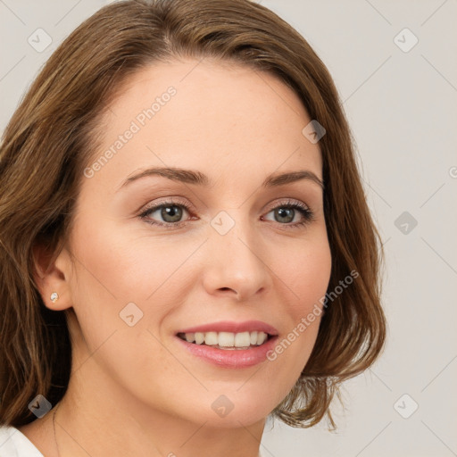 Joyful white young-adult female with long  brown hair and green eyes