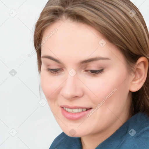 Joyful white young-adult female with long  brown hair and blue eyes