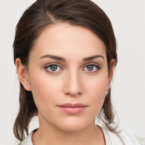 Neutral white young-adult female with medium  brown hair and brown eyes