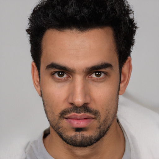 Neutral white young-adult male with short  black hair and brown eyes