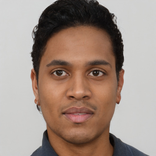 Neutral latino young-adult male with short  black hair and brown eyes