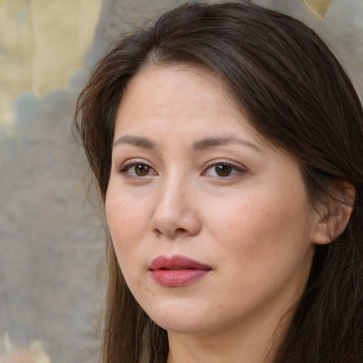 Joyful white adult female with long  brown hair and brown eyes