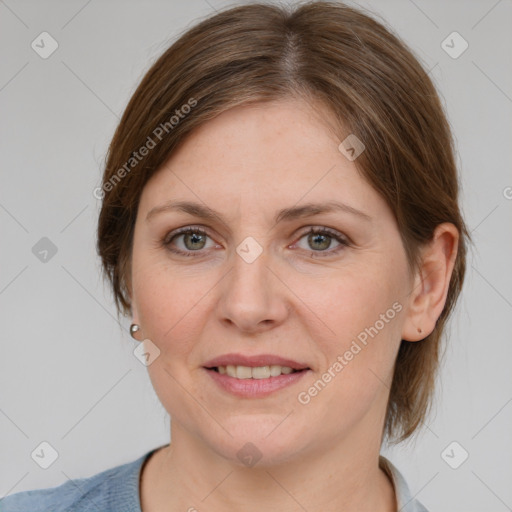 Joyful white adult female with medium  brown hair and grey eyes