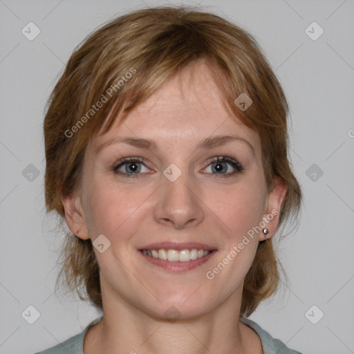 Joyful white young-adult female with medium  brown hair and blue eyes