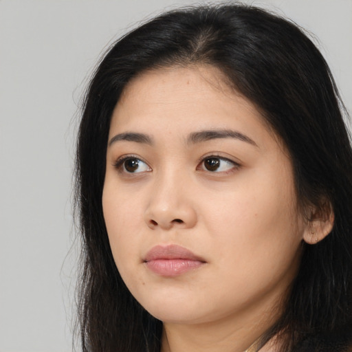 Neutral asian young-adult female with long  brown hair and brown eyes