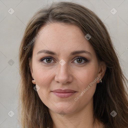 Joyful white adult female with long  brown hair and brown eyes