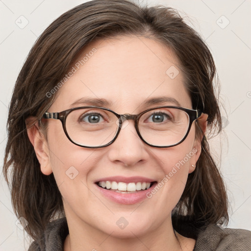 Joyful white adult female with medium  brown hair and blue eyes