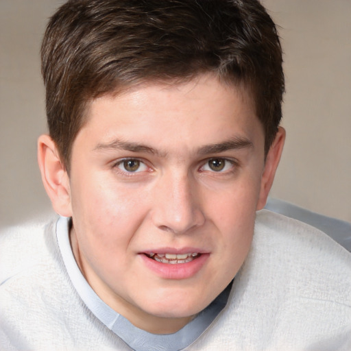 Joyful white young-adult male with short  brown hair and blue eyes