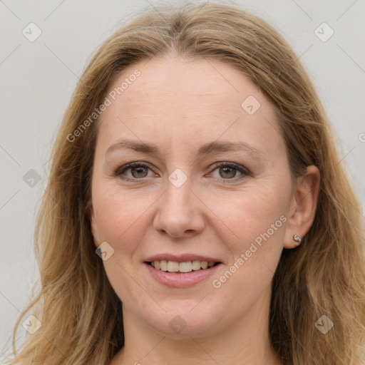 Joyful white young-adult female with long  brown hair and blue eyes