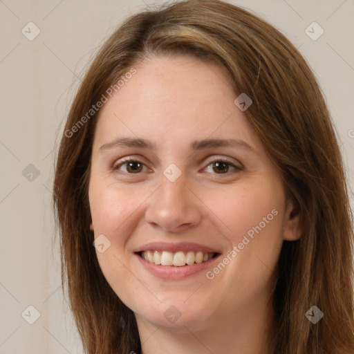 Joyful white young-adult female with long  brown hair and green eyes