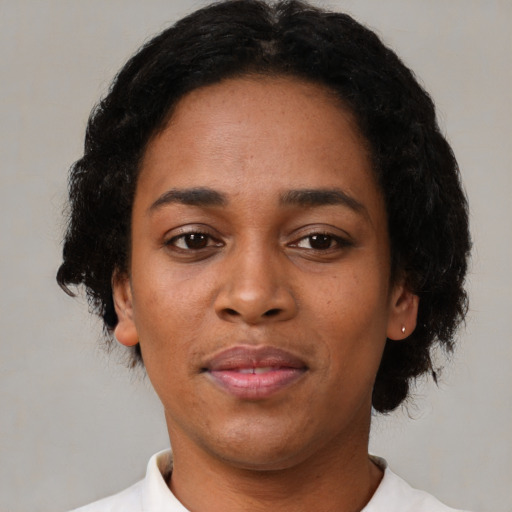 Neutral latino young-adult female with short  black hair and brown eyes