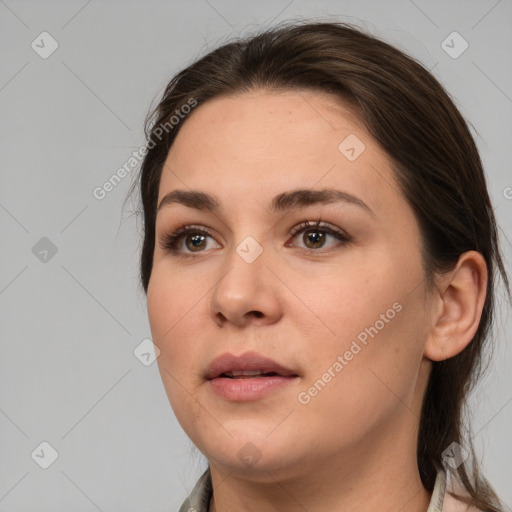 Neutral white young-adult female with medium  brown hair and brown eyes