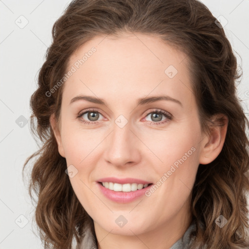 Joyful white young-adult female with long  brown hair and green eyes