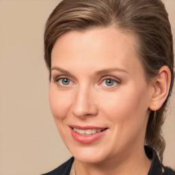 Joyful white adult female with medium  brown hair and brown eyes