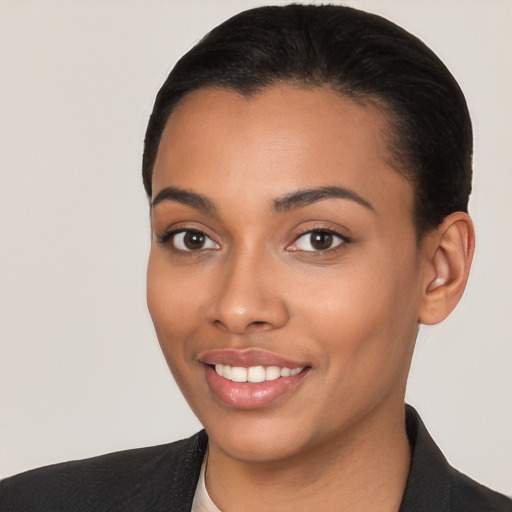 Joyful latino young-adult female with short  black hair and brown eyes