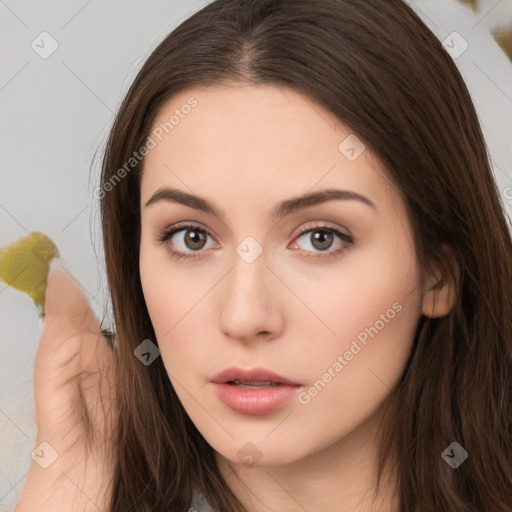 Neutral white young-adult female with long  brown hair and brown eyes