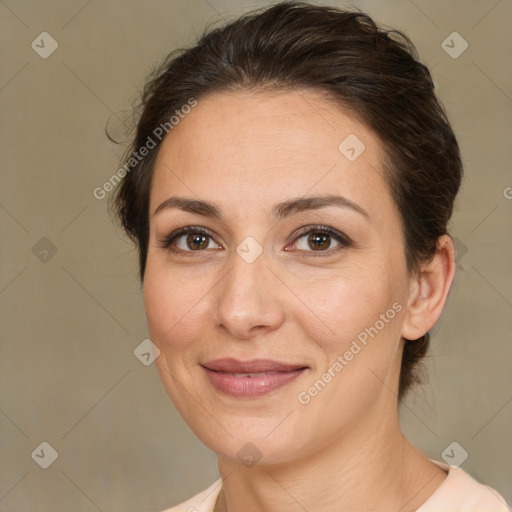 Joyful white adult female with medium  brown hair and brown eyes