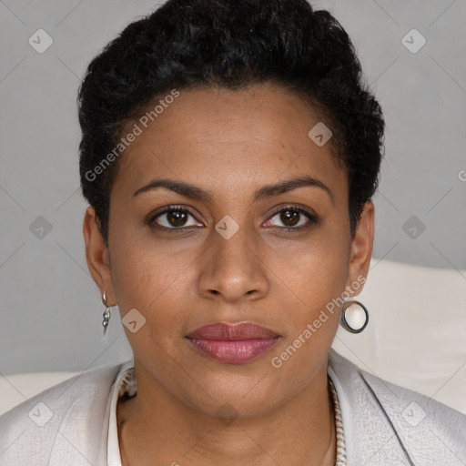 Joyful black young-adult female with short  black hair and brown eyes