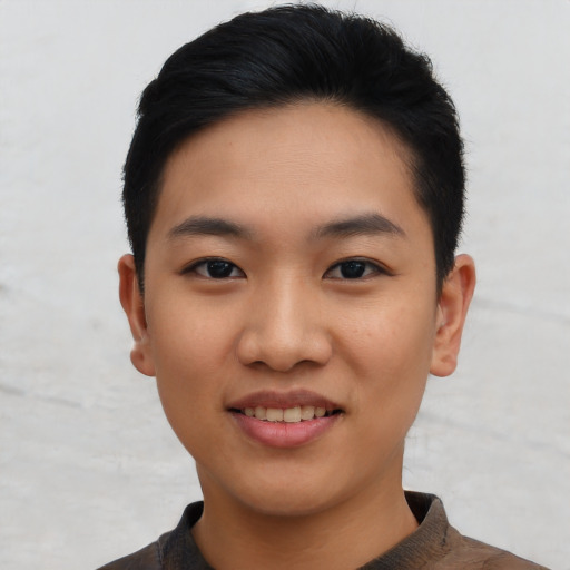 Joyful asian young-adult female with short  black hair and brown eyes