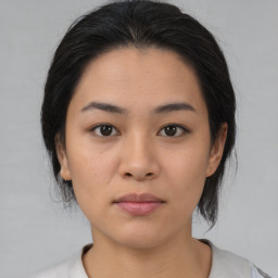 Neutral asian young-adult female with medium  brown hair and brown eyes