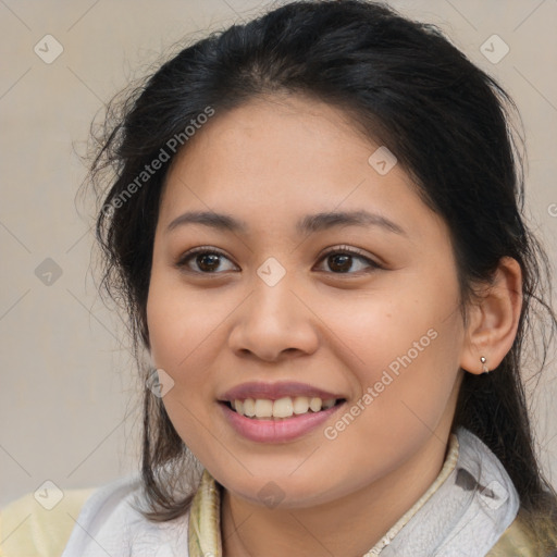 Joyful latino young-adult female with medium  brown hair and brown eyes