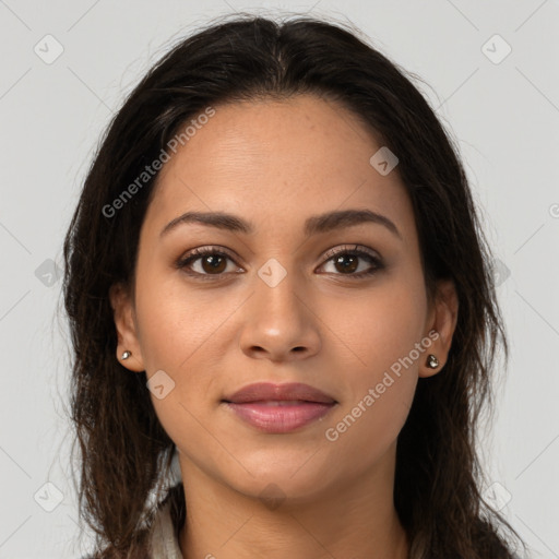 Joyful latino young-adult female with long  brown hair and brown eyes