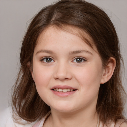 Joyful white child female with medium  brown hair and brown eyes